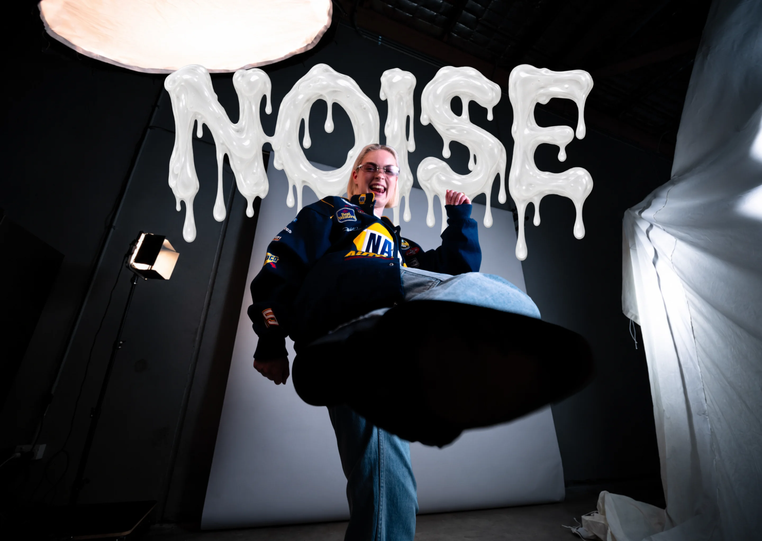 Issue 01 cover: Lucy Hay mid-kick in a photo studio under the NOISE wordmark