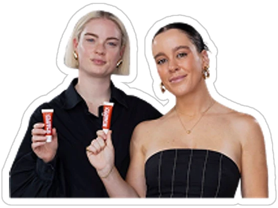 Lucy and Annabel Hay, each holding up a tube of Clutch Glue